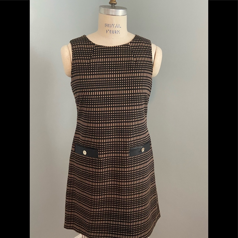 Easy dressing! Accentuate your best with this terrific dress! Wash and hang.